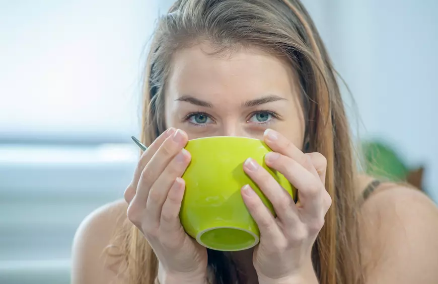 woman drinking bone broth